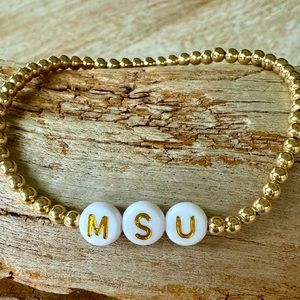 Handmade 14 karat gold filled stretch MSU bracelet